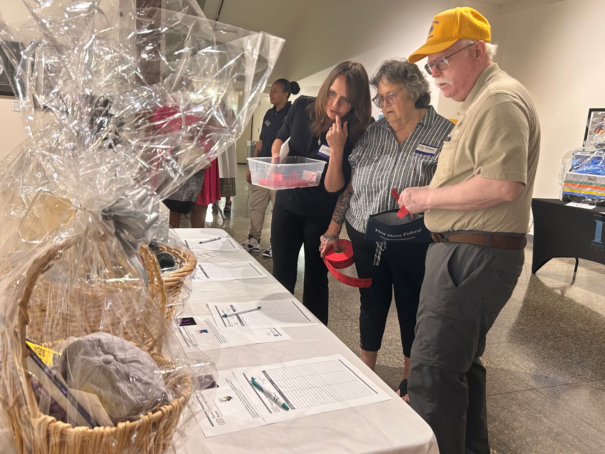 Fuzzy anonymous picture of group meeting with chair pulled out for newcomers.